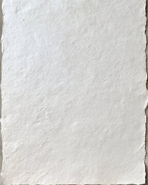 Textured white handmade paper sheet with torn uneven edges for design