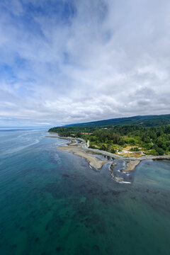 Aerial Coastal View Of Rocky Shoreline And Forested Coastline On Vancouver Island, British Columbia, Canada