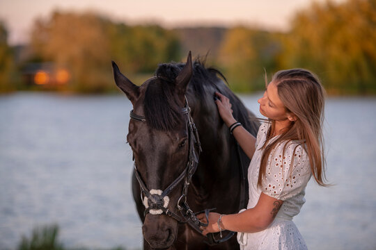 Beautiful woman wtih horse in coutriside