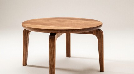 Fototapeta premium Round wooden coffee table with minimal design sits on light background. Small modern furniture piece features smooth grain texture. Empty table top provides space for home decor items. Scandinavian