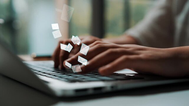Hands Typing on Laptop Keyboard with Floating Email Icons Illustrating Digital Communication and Messaging Concept in Modern Workspace Environment. Entropy.