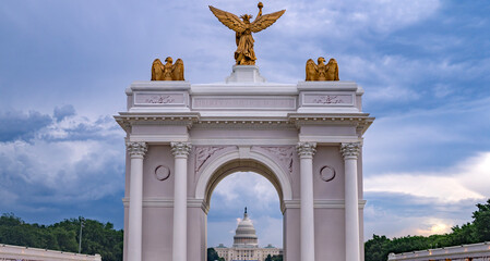 Fototapeta premium Washington DC arch frames Capitol. Patriotic Washington DC arch construction. Ceremonial Washington DC arch landmark. Washington DC arch marks America 250.