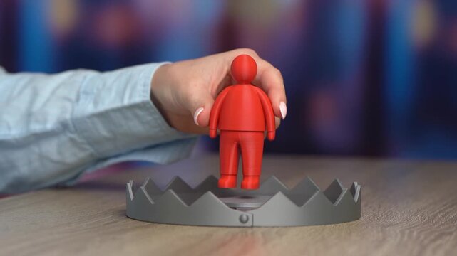 A trap with a red man figurine as bait. Candidates with poor backgrounds and security risks. Recruitment screening, threat detection. Corporate safety awareness.