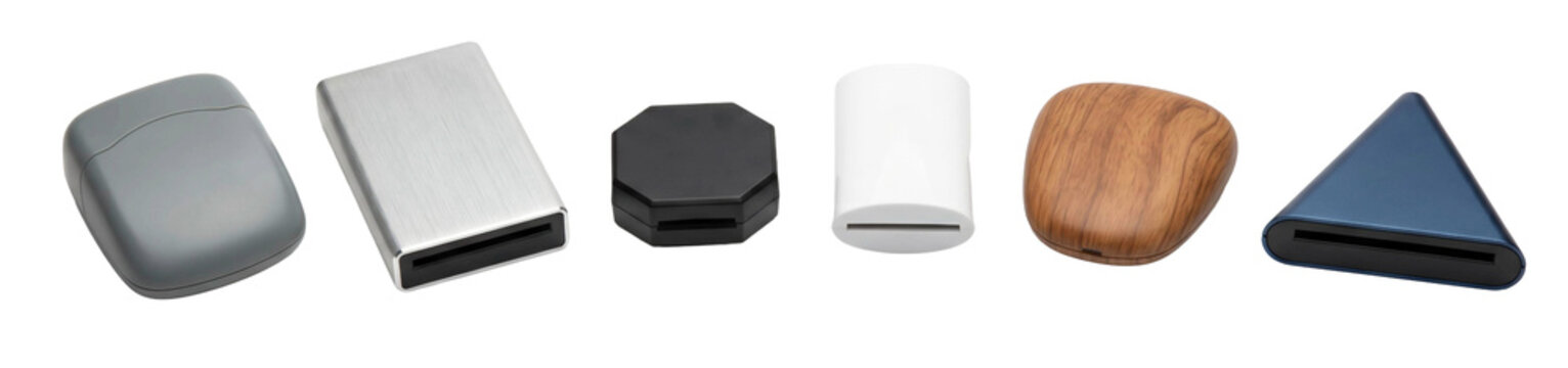 Collection of various memory card readers in different shapes, materials, and colors, including metal, plastic, and wood finishes, showcasing a variety of modern peripheral designs