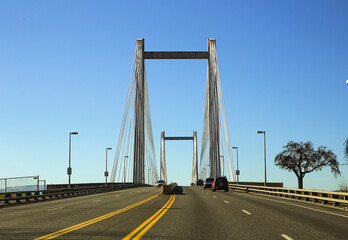 Fototapeta premium Driver view across cable suspension bridge