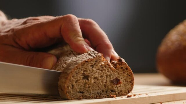 Bread multigrain loaf held in hands, whole wheat seeded crust with millet and seeds, close-up macro shot