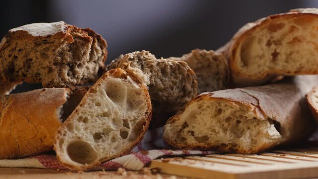 Bread assortment, mixed Spanish baguette loaves from Barcelona bakery, close-up macro shot showing crumb texture
