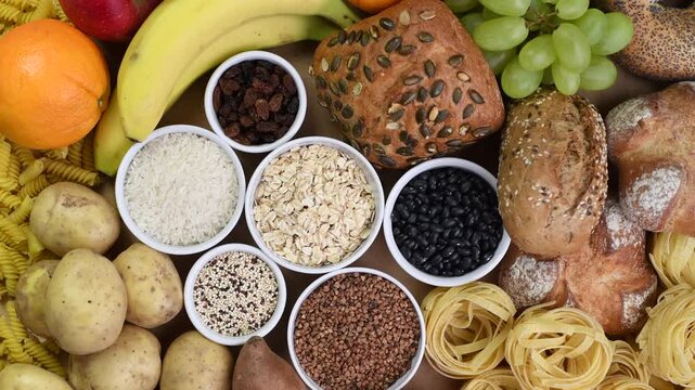 Carbohydrates food sources, top view, rotating 