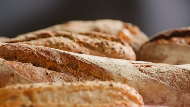 Baguette Bread torn apart by hand, fresh baguette crumb close-up macro shot showing soft airy texture