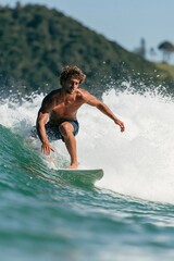 Fototapeta premium Male surfer riding breaking wave on green ocean near rocky shoreline for action sports banner and adventure background