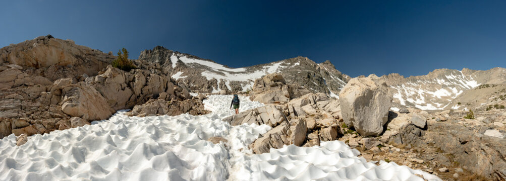 Panorama Of Backpacker Climbing Glen Pass Snow Field