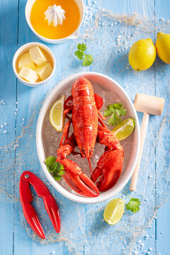 Boiled and spicy lobster with orange butter sauce.