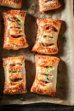 Crispy sausage in puff pastry as a snack for breakfast.