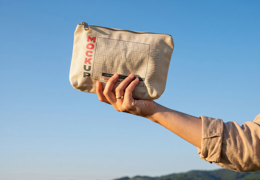 Cosmetic Pouch Hold by Hand Outdoor Mockup