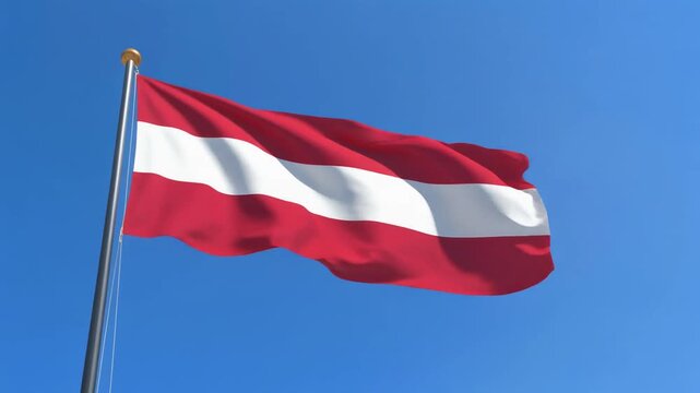 Latvia Flag Waving on Metal Flagpole Against Clear Blue Sky
