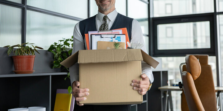 Guy got job. Hired manager company. Hiring employee. Man office worker. Hired man hold box with personal stuff in office. Businessman got hired job, cropped. Taking box with personal stuff to office