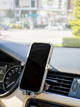 Black Smartphone Mounted on Universal Car Air Vent Holder