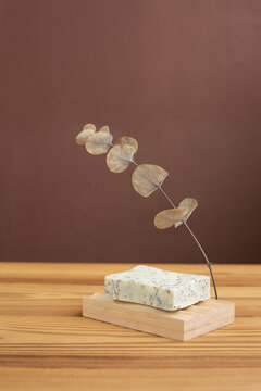 Natural herbal soap with scrub. Handmade soap bars on a wooden background. Space for text. 