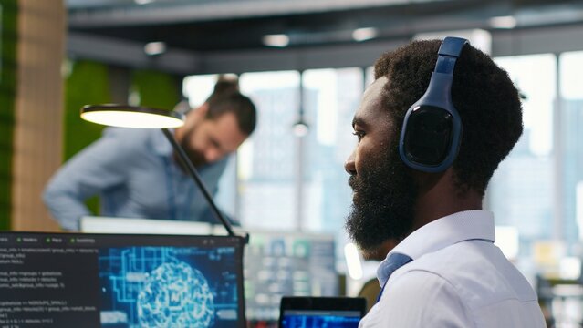 Programmer uses AI and machine learning to automate repetitive tasks across office devices, applying neural networks to speed software feature implementation and improve productivity.