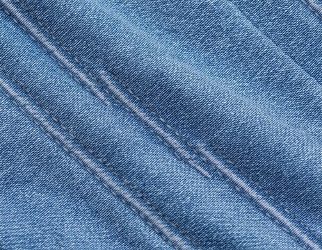 high quality seamless light blue denim fabric texture background with detailed diagonal weave pattern for fashion apparel design and textile mockup