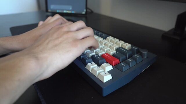 Over the Shoulder View of Typing on Keyboard