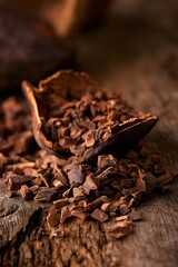 Fototapeta premium Cracked Cocoa Bean with Raw Nibs on Rustic Wood