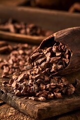 Fototapeta premium Cracked Cocoa Bean with Raw Nibs on Rustic Wood