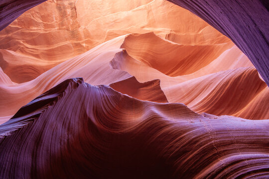 Swirling natural patterns formed by erosion over  millennia in Navajo Sandstone of Antelope slot canyons near Page