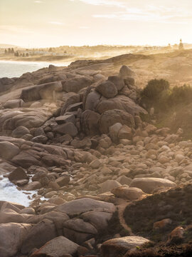 Moody afternoon light with sea spray on the rocks in Port Elliot South Australia looking towards Rocky Bay and Green Bay
