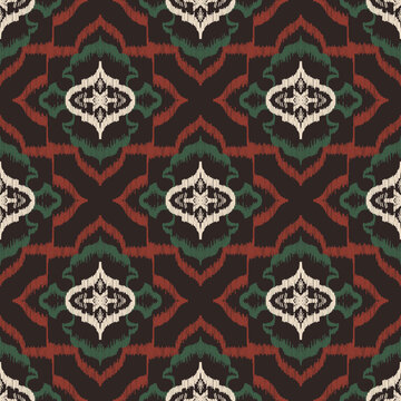 Seamless ethnic ikat pattern with dark black ogee medallion ornament. Embroidered stitch texture design for bohemian fabric, textile, apparel, wallpaper, and background.