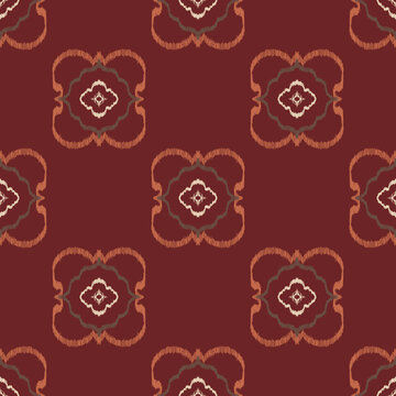 Seamless ethnic ikat pattern with burgundy floral medallion ornament. Embroidered stitch texture design for bohemian fabric, textile, apparel, wallpaper, and background.