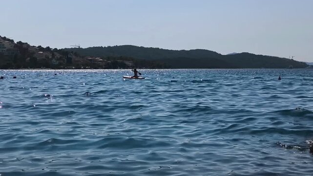 Woman relaxing on a pedal boat during a summer outing