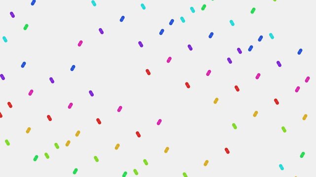 Multicolored vitamin capsules falling in a vibrant rainbow shower on white background