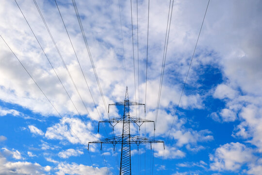 Electric transmission pylon and overhead power lines.electricity distribution, power infrastructure,energy security,utility network,sustainable energy transition 