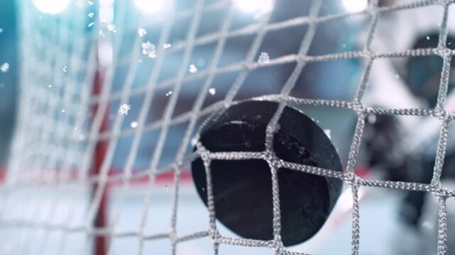 Super Slow Motion Hockey Goal at Professional Ice Arena. Puck Hitting Net at 1000fps