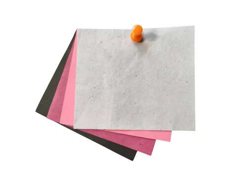 Colorful paper stack with pushpin on whiteboard