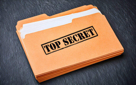 Yellow file with documents and Top Secret stamp on black table, top view