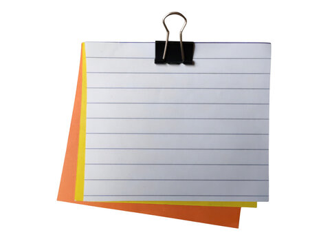Blank lined paper clipped with binder on