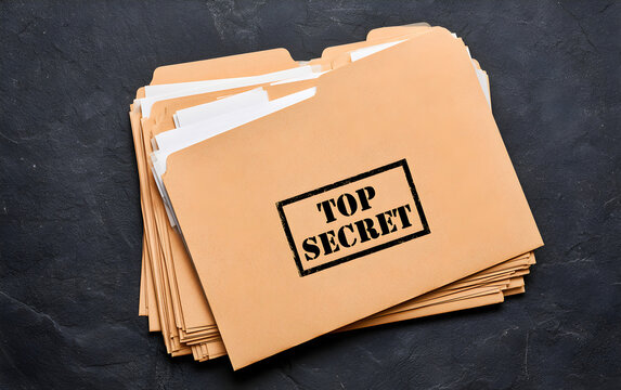 Yellow file with documents and Top Secret stamp on black table, top view