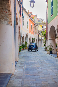 Ancient medieval village of Zuccarello with a historic Fiat 500 L, located in the Neva River valley, in the province of Savona, Liguria, Italy. Among the most beautiful villages in Italyria, Italy.