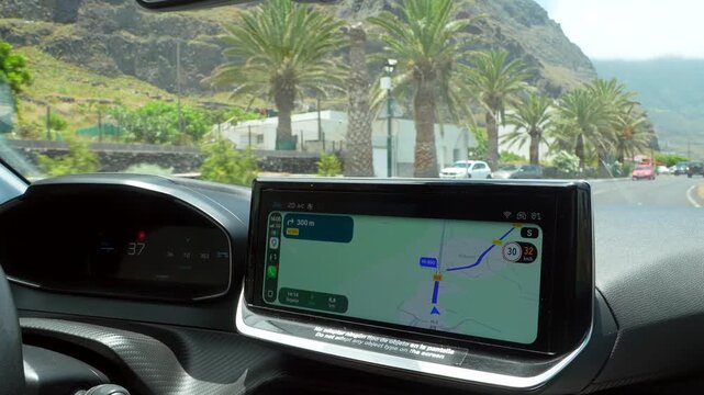 Driving a car with gps navigation on a scenic road trip