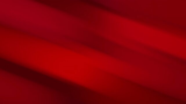 Seamless looping abstract red motion background featuring smooth blurred diagonal bands and layered gradients flowing continuously across a deep red and crimson color field