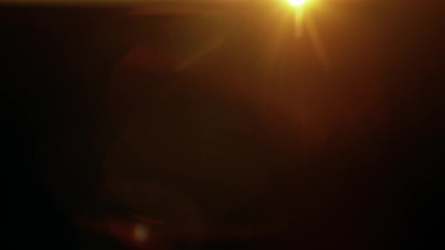 Real Shooted Anamorphic Lens Flare on Black Background in Super Slow Motion.