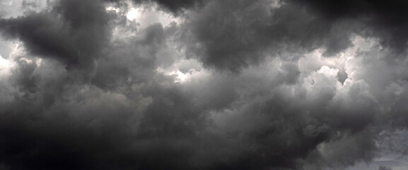 Banner Dramatic dark storm clouds black sky background. Dark thunderstorm clouds rainny season....