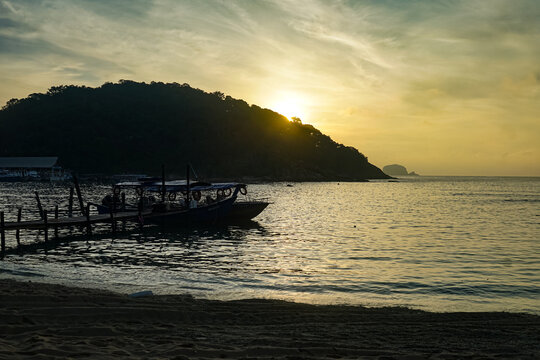 Wooden Boat At Sunrise Coastline