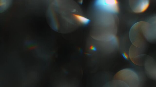Real Shooted Cinematic Light Bokeh Overlay on Black Background in Slow Motion.