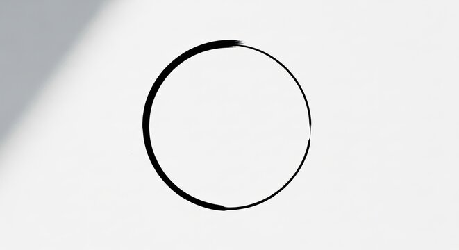 Simple black brushstroke circle on white background, creating abstract, minimalist art