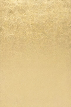 Gold leaf gilding background in warm oatmeal with bottom third copy sp