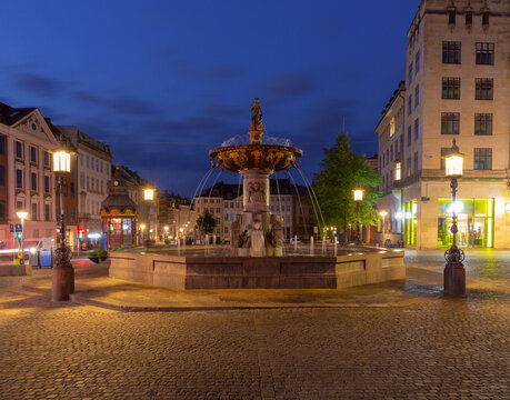 Stork Fountain at Amagertorv Square at Night in Copenhagen Denmark