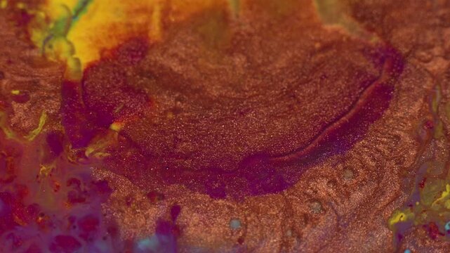 Liquid paint footage. Abstract Cinematic Motion Macro Acrylic Footage Background in Red copper Gold Magenta Pink Yellow